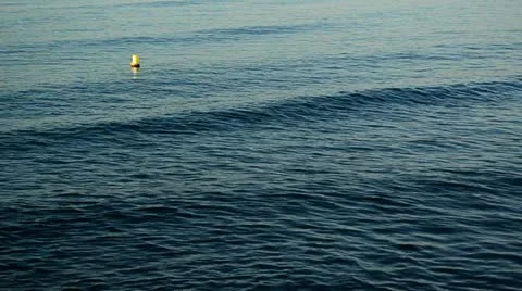 Blue sea with floating yellow elements 02 Stock-Footage 12615086