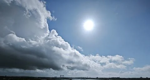 Blue Sea Landscape with Powerful Cloud Formation and Rays of Light Over the Hori Stock Photos