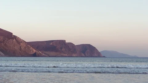 Blue Sea with Pink Cliffs Stock Footage 97908343