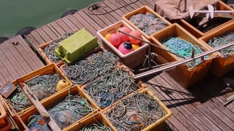 Blue Sea Ropes Boxes Jetty Wooden Planks Dock and Orange Mini Buoys Maritime Stock Footage 280345346