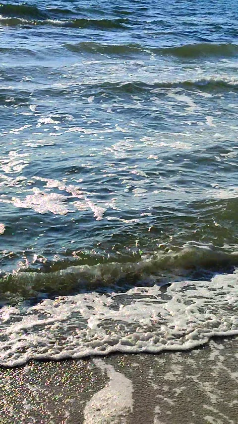 Blue sea sun glare surface sea waves sunny summer day Waves blue sea Vertical Stock Footage 308182191