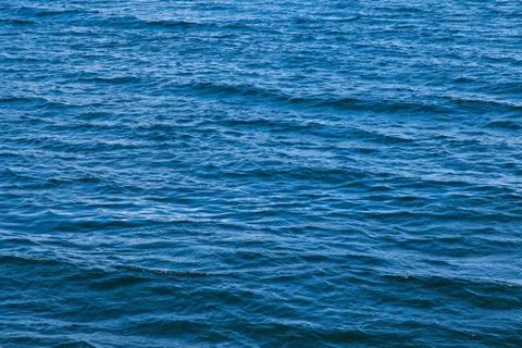 Blue sea surface with small waves Stock Photos