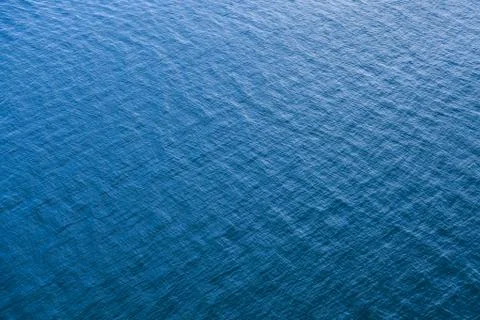 Blue sea surface with small waves Stock Photos