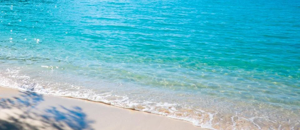 Blue sea surface with waves texture on beach background Stock Photos