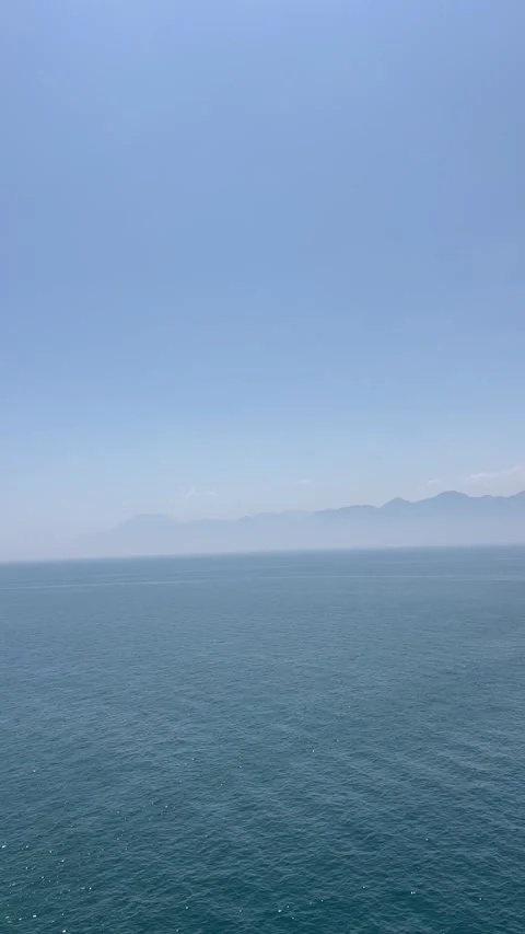 Blue sea under blue sky Stock Footage 337029701