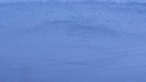 Blue sea water surface with small waves and ripples from wind. Vídeos de archivo 116365224