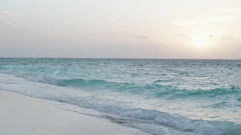 Blue sea with waves and white sand beach at sunset. Nature tropical Island. Stock Footage 164249062