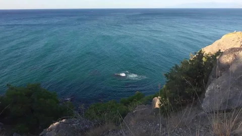 Blue sea waves are waves are breaking jn the stone under water Stock Footage 130754244