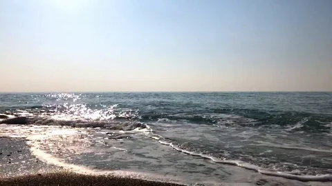 Blue sea, the waves beating against the shore Stock Footage 121332018