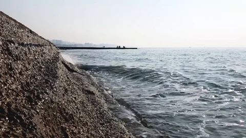 Blue sea, the waves beating against the shore Stock Footage 121332076
