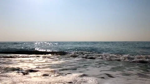 Blue sea, the waves beating against the shore Stock Footage 121332151