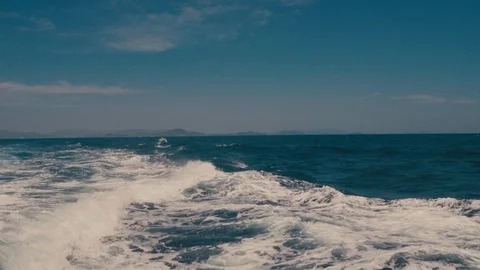 Blue sea waves behind passenger boat Stock Footage 103221555