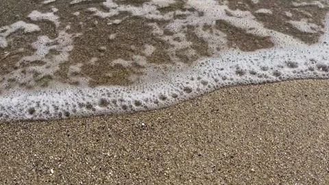 Blue sea waves breaking on sandy coastline 動画素材 329319737