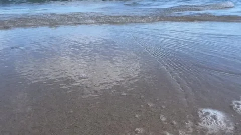 Blue sea waves breaking on sandy coastline Stock Footage 329319748