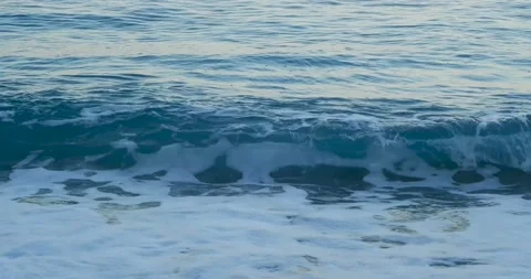 Blue sea waves close up with white foam Stock Footage 165052955