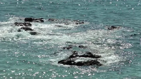 Blue sea waves rocks foam sparkling highlights Stock Footage 48600836