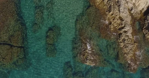 Blue sea Waves to rocks overhead Stock Footage 102515857