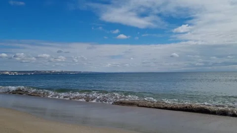 Blue sea waves rolling calmly under cloudy sky Stock Footage 319252317