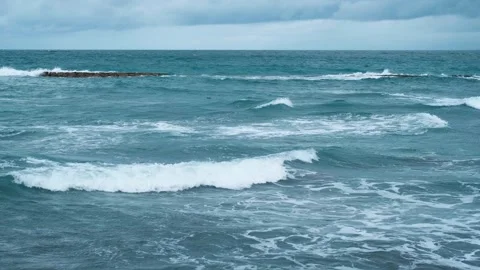 Blue sea waves in slow motion Stock Footage 265681927