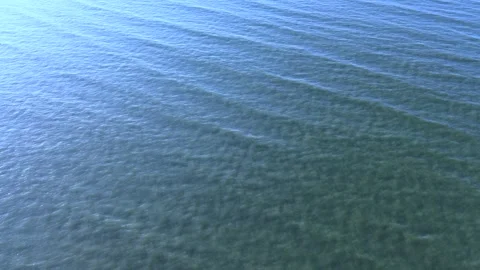Blue sea waves at sunset seen from drone Stock Footage 327100111