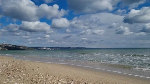 Blue sea waves under cloudy sky on calm peaceful day Stock Footage 319252400