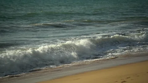 Blue sea waves wash the sandy shore Stock Footage 309752432
