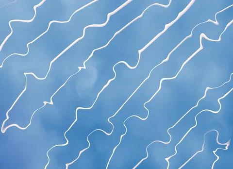 Blue seamless pattern with thin white diagonal wavy lines Stock Illustration