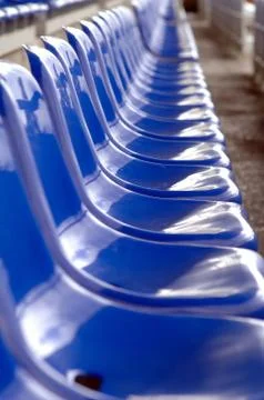 Blue seats in a stadium Stock Photos