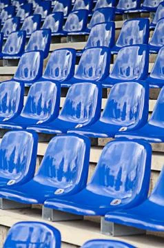 Blue seats in a stadium Stock Photos