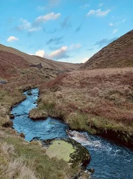 Blue secluded stream in valley Stock Photos