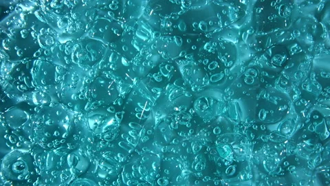 Blue serum texture, clear liquid gel background. Motion, rotation of the Stock Footage 148442021