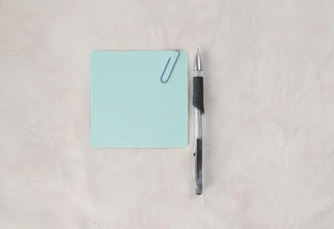 Blue sheet of paper for notes and pen on paper background Stock Photos