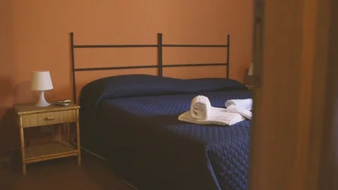 Blue sheets bedoom with towels Stock Footage 86751248