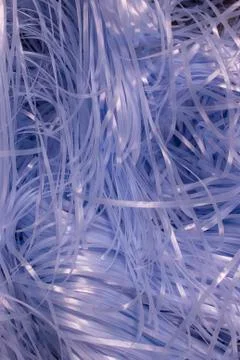 Blue shredded plastic fake Easter grass background Stock Photos