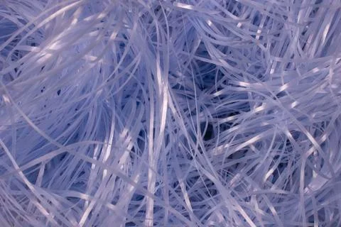 Blue shredded plastic fake Easter grass background Stock Photos
