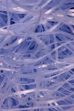 Blue shredded plastic fake Easter grass background Foto stock