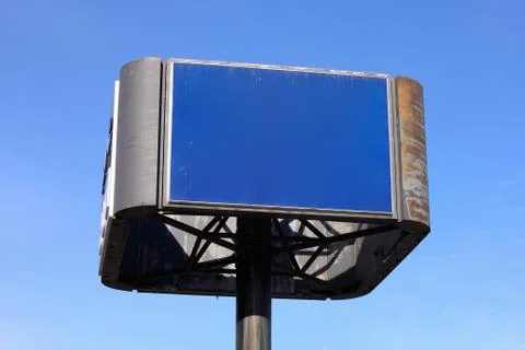 Blue Sign before a Cloudless Sky Stock Photos