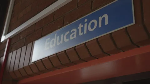 A blue sign with the word education written on it Stock Footage 301622341