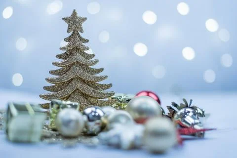 Blue silver Christmas tree and balls on the background of blue bokeh lights Stock Photos
