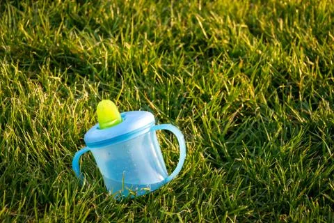 A blue sippy cup Stock Photos