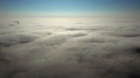 Blue sky above the clouds. Aerial view above clouds. Fly over the clouds Video stock 164376563