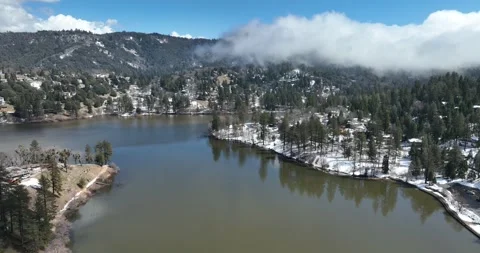 Blue Sky Above Lake Below Cloud Moving Over Mountains Crestline California Video stock 335793958