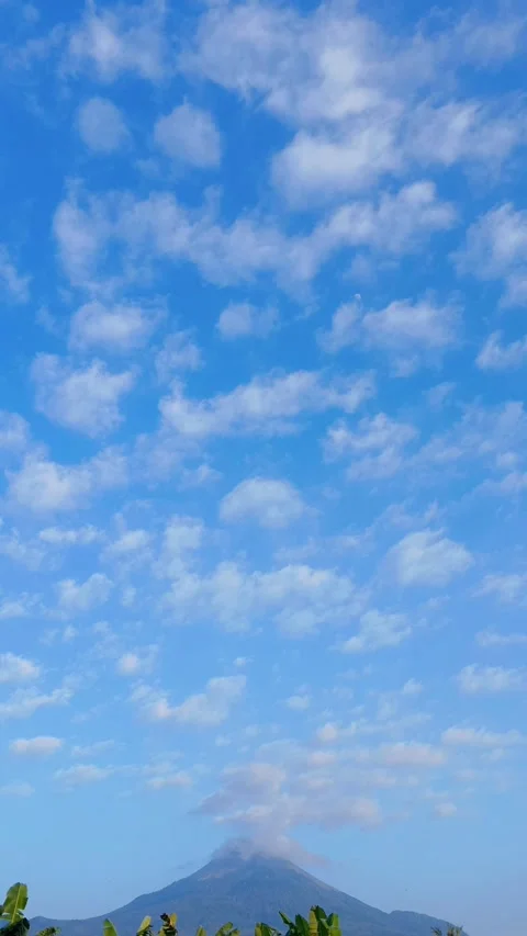 Blue sky with altocumulus clouds moving to mountain - vertical video Stock Footage 343806410