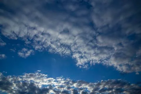 Blue sky among clouds Stock Photos