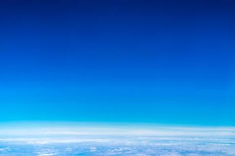 Blue sky and Cloud Top view from airplane window,Nature background. Stock Photos
