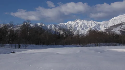 Blue sky and clouds are snowy mountains Winter appearance is snowy mountains Stock Footage 148127411