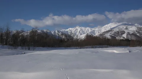 Blue sky and clouds are snowy mountains Winter appearance is snowy mountains 스톡 동영상 148127656