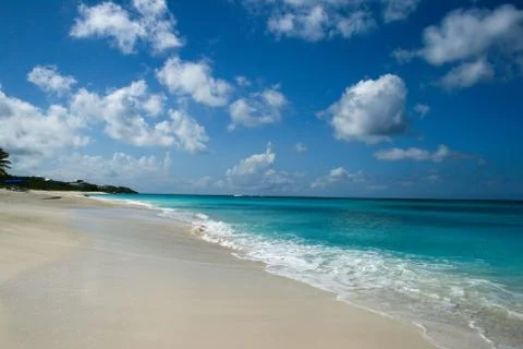 Blue Sky and clouds looking over Azure waters of Shoal Bay beach Anguilla Stock Photos