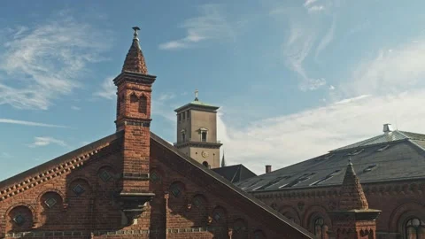 Blue sky and clouds moves over church in copenhagen Stock Footage