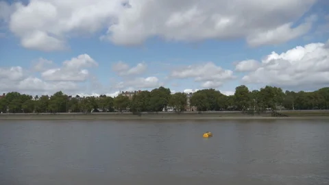Blue sky and clouds moving over a riverside. Stock Footage 160446246